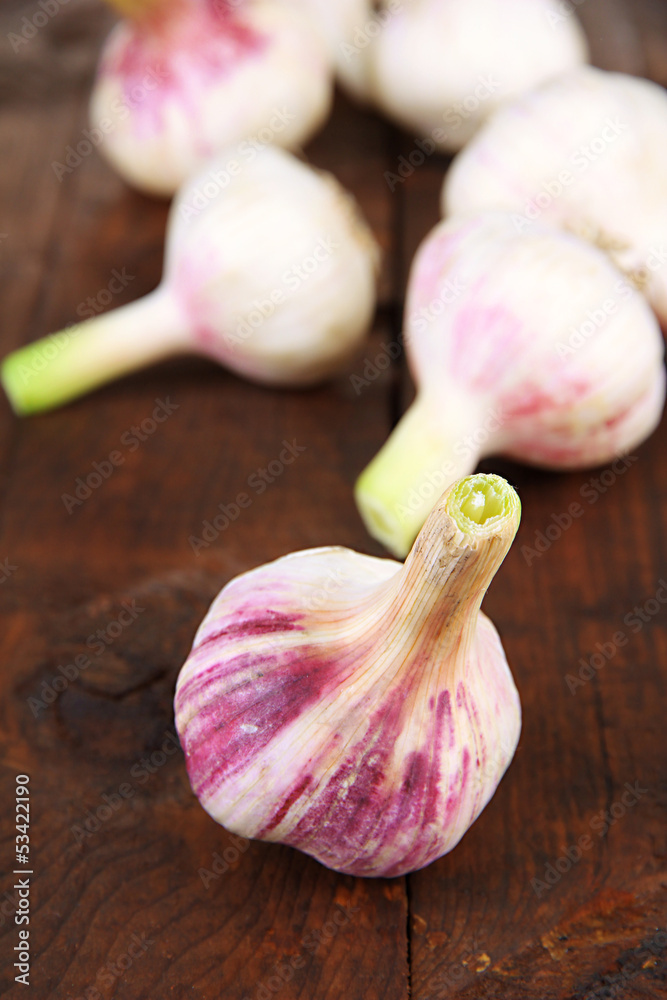 Fototapeta premium Fresh garlic, on wooden background