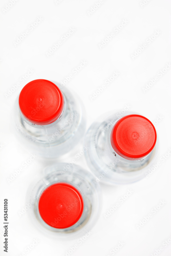Water bottles with red cap, top view Water bottles with red cap, top view
