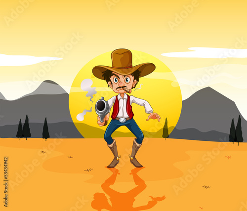 A cowboy holding a gun in the middle of the desert