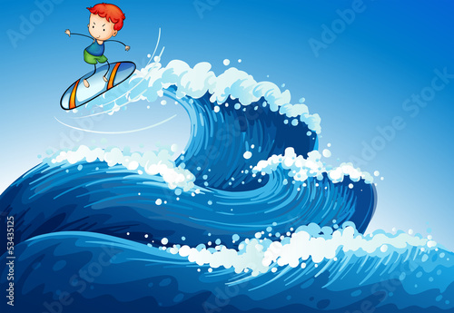 A little boy surfing at the sea