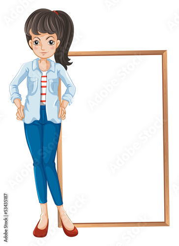 A girl standing with a blankboard at the back
