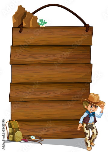 A cowboy and the empty wooden signboards