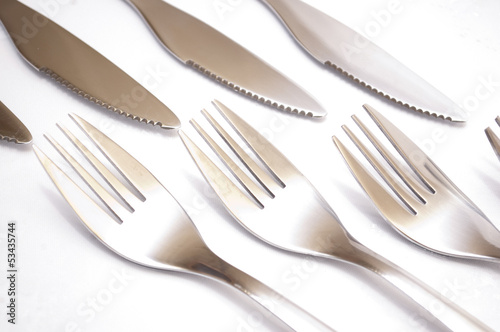 series of forks and knives against each other