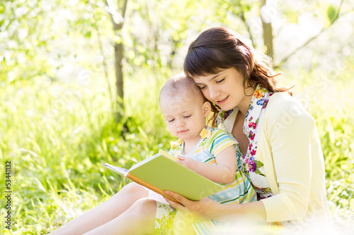 happy mother reading a book...