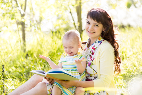 happy mother reading a book...
