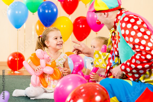 happy kids and clown on birthday party