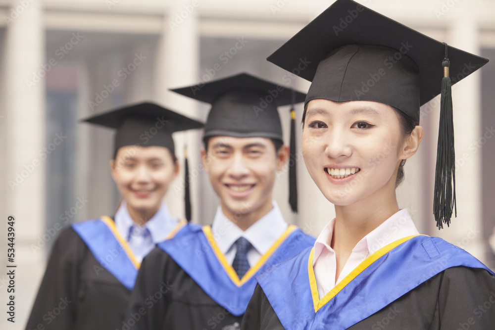 Three University Graduates Smiling in a Row