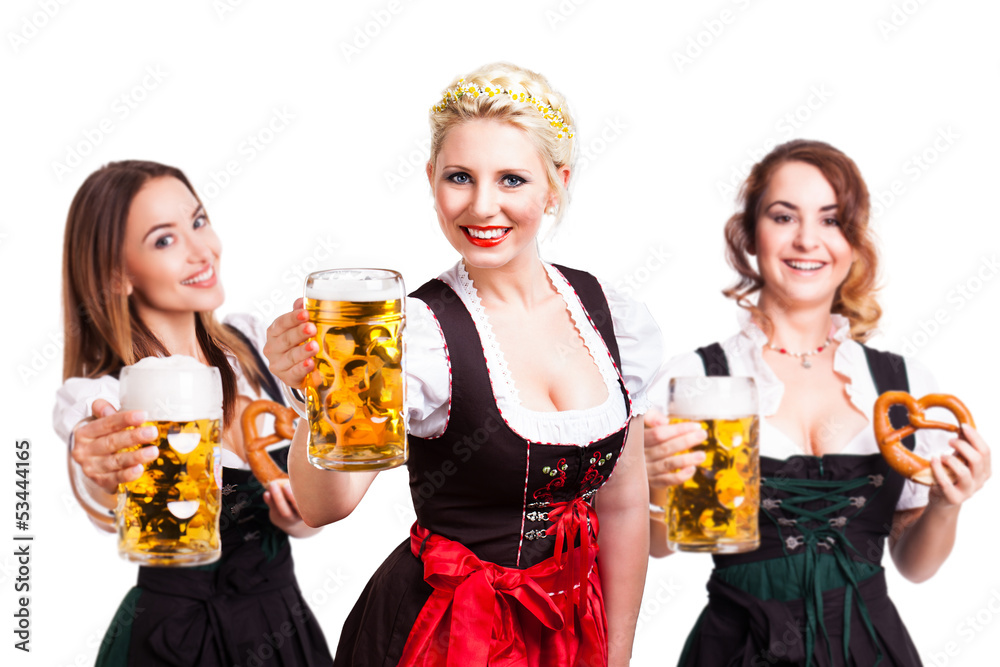 3 attraktive junge Frauen in Dirndls mit Bierkrügen 3 attraktive junge Frauen in Dirndls mit Bierkrügen