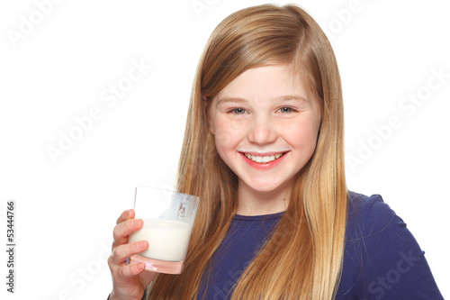 girl with a glass of milk and milk moustache smiling