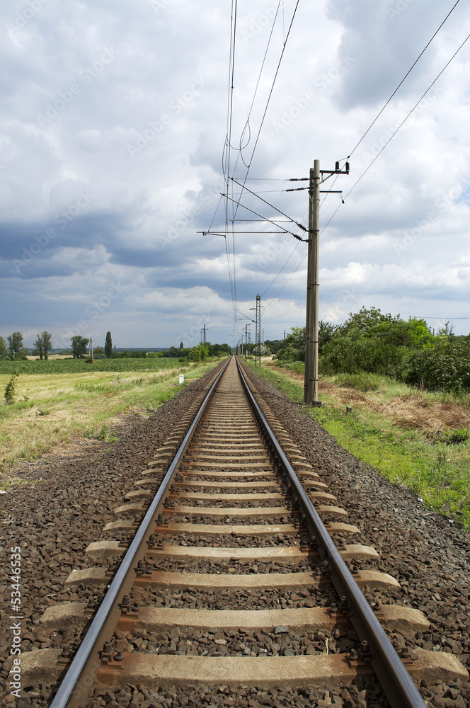 Straight railway leads to the horizon