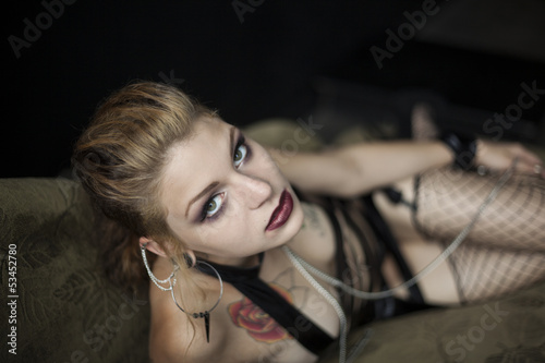Obraz na płótnie Young Woman Lying on Couch in Her Underwear w salonie