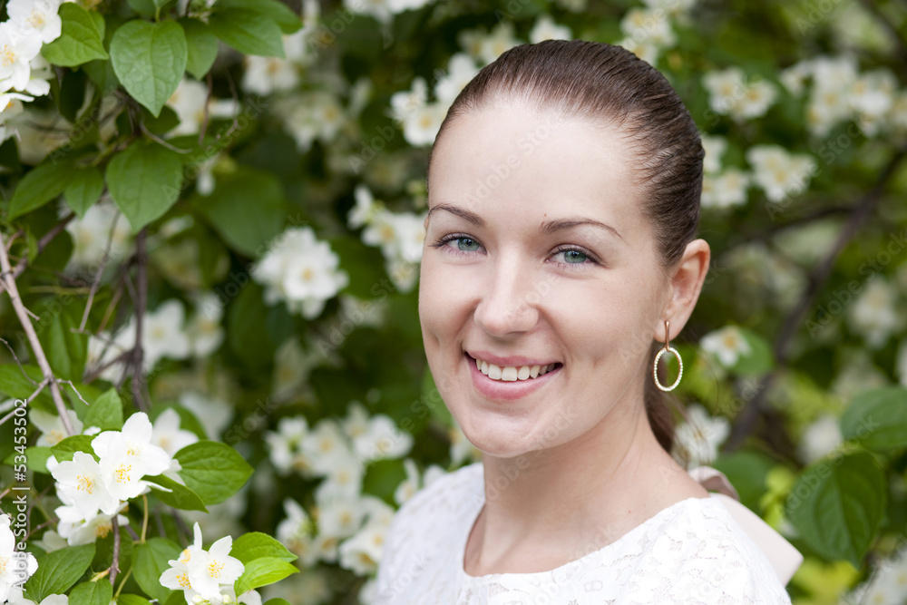 Portrait of beautiful brunette in spring blossom Portrait of beautiful brunette in spring blossom