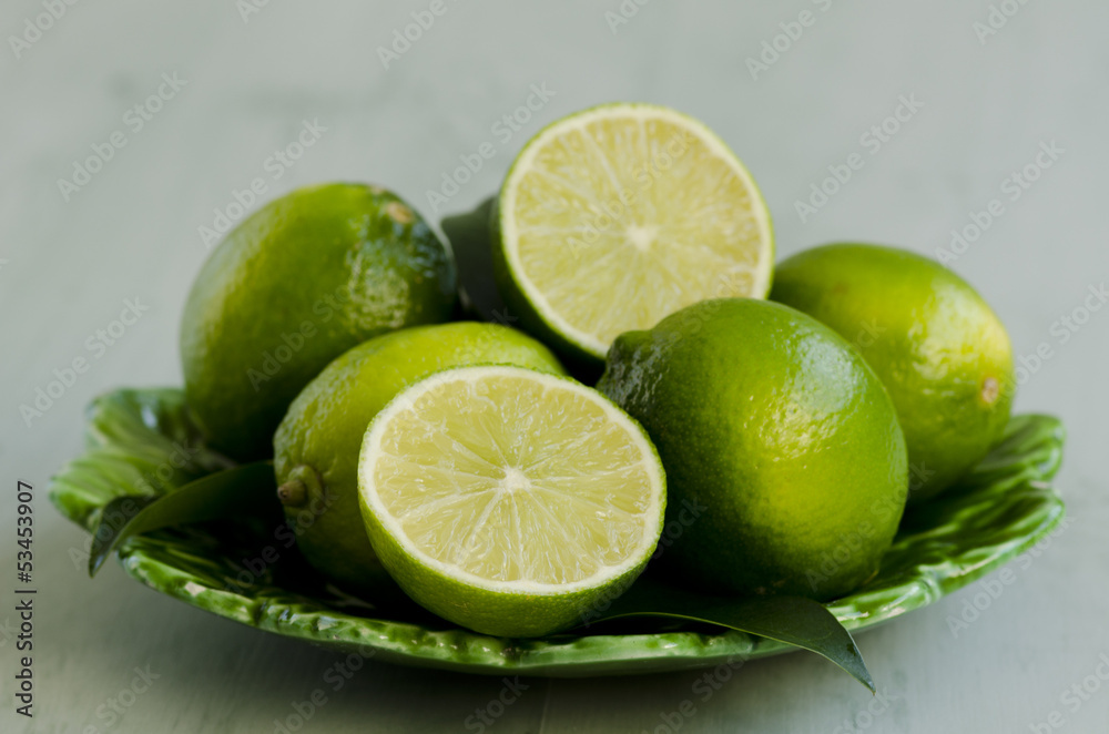 Limes in a ceramic plate. Limes in a ceramic plate.