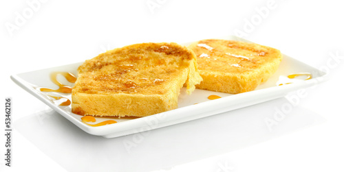 White bread toast with honey on plate, isolated on white