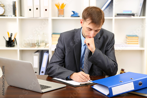Young businessman in office...