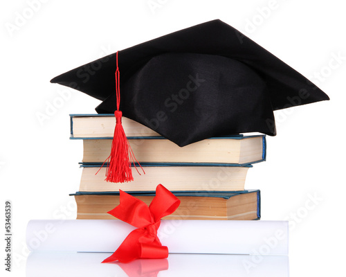 Grad hat with diploma and books isolated on white