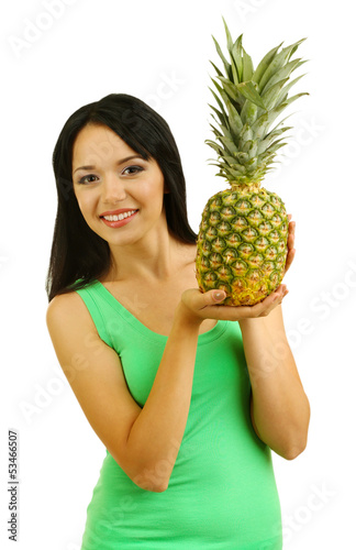 Girl with fresh pineapple isolated on white