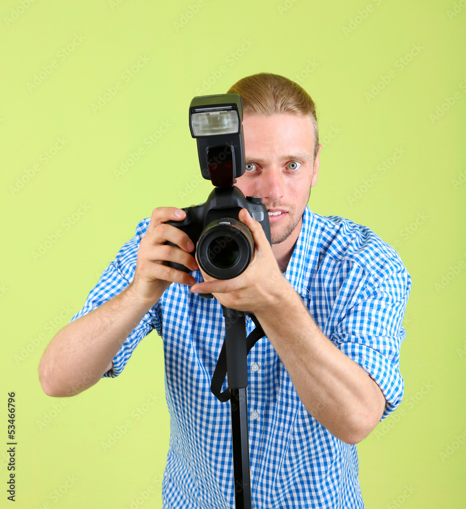 Handsome photographer with camera
