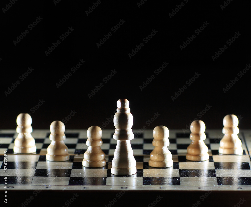 Composition with chessmen on glossy chessboard Composition with chessmen on glossy chessboard
