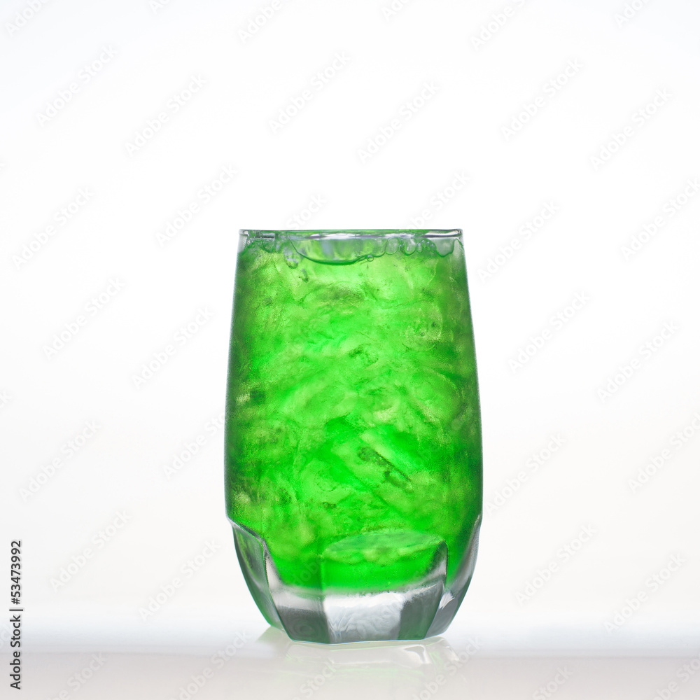 Green fruit flavor soft drinks whit soda water isolated Green fruit flavor soft drinks whit soda water isolated