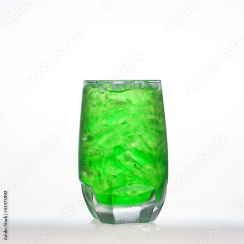 Green fruit flavor soft drinks whit soda water isolated