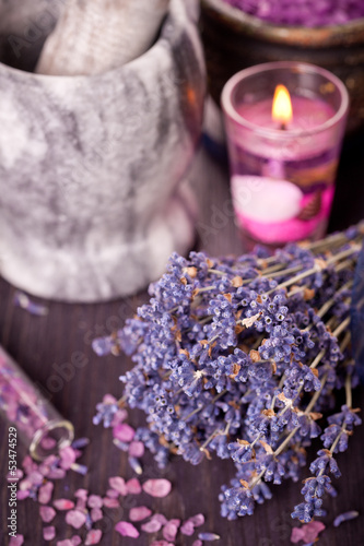 Burning candles  a bouquet of dried lavender and sea salt