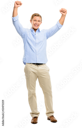 Happy young man celebrating with arms up isolated on white backg