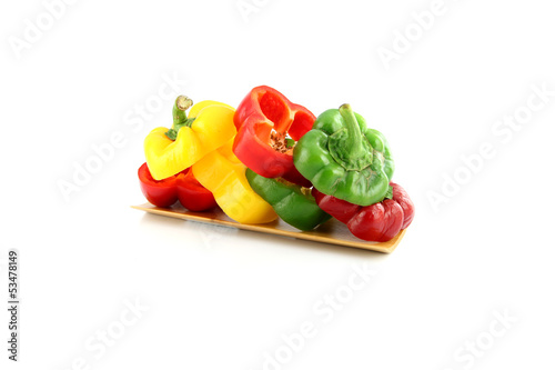 Slice the Three color of bell pepper in placing stacked.