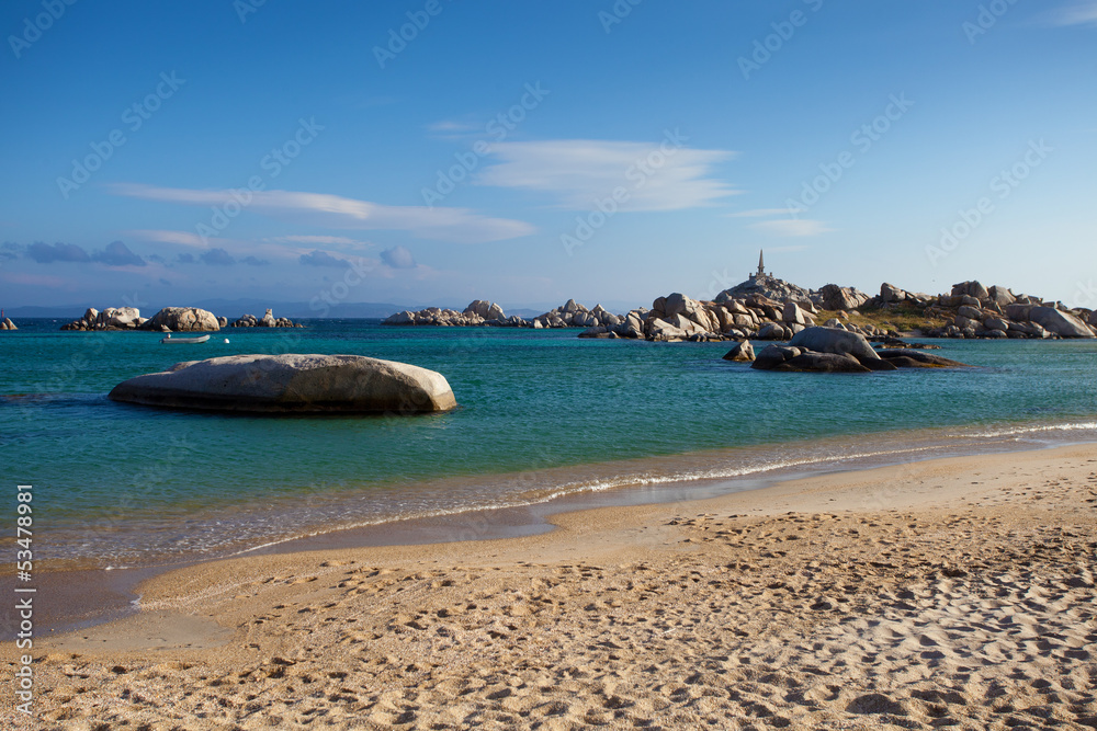 Beach on Lavezzi island with lighthouse, Corsica, France