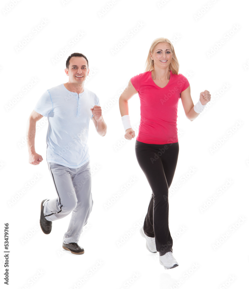 Fitness couple running towards camera Fitness couple running towards camera