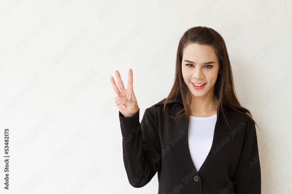 woman business executive showing 3 or three fingers hand gesture woman business executive showing 3 or three fingers hand gesture