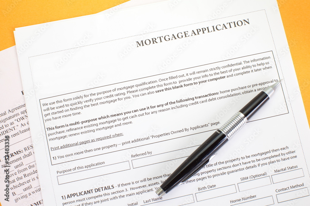 Close up of a mortgage application and a pen Close up of a mortgage application and a pen