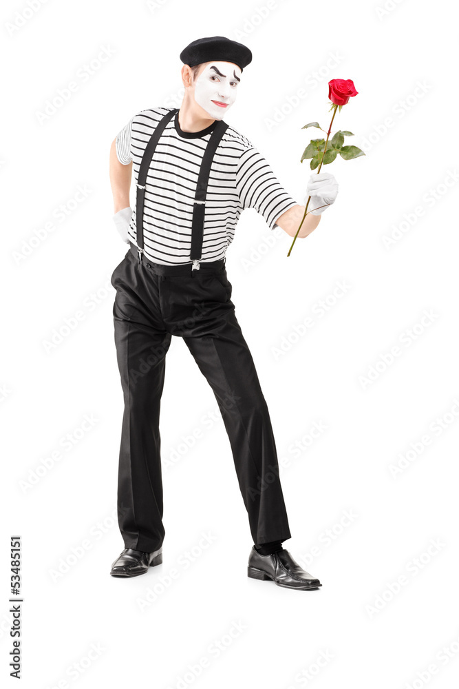 Full length portrait of a mime asrtist giving a rose flower Full length portrait of a mime asrtist giving a rose flower