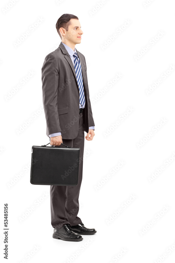 Full length portrait of a young businessman with briefcase stand Full length portrait of a young businessman with briefcase stand