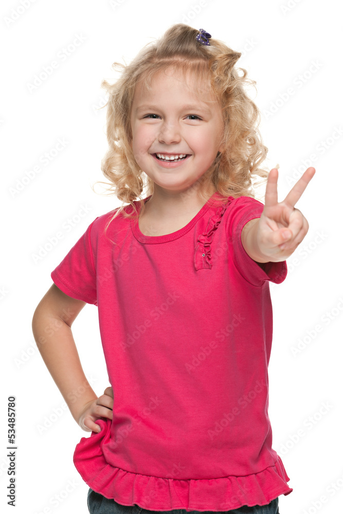 Laughing little girl shows victory sign Laughing little girl shows victory sign