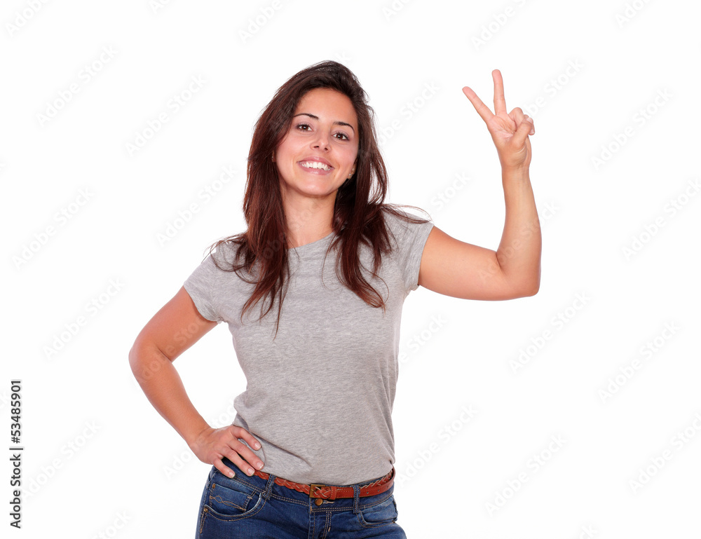 Smiling woman showing victory sign with fingers Smiling woman showing victory sign with fingers