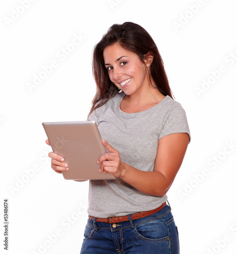 Attractive young woman using her tablet pc © pablocalvog
