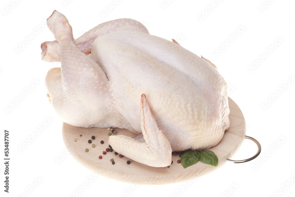 Fresh chicken on wooden board with spices Fresh chicken on wooden board with spices