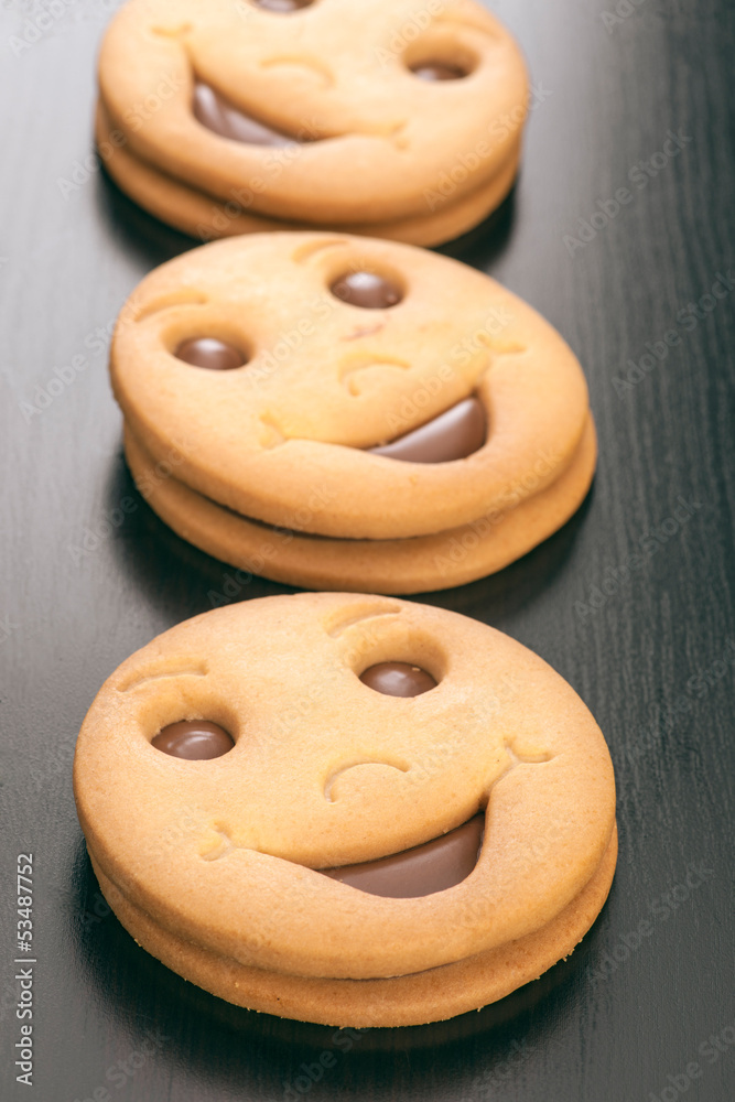 group of smiling filled chocolate biscuits group of smiling filled chocolate biscuits