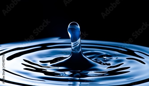 Water splash macro, dark blue background