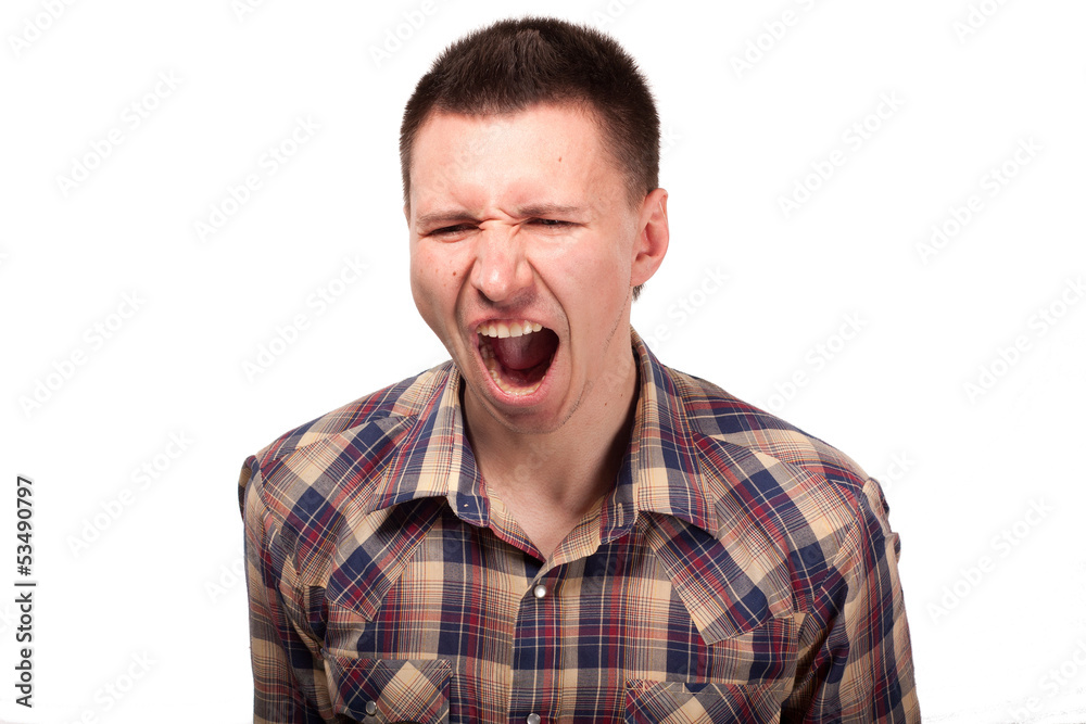 Man in a plaid shirt shouts Man in a plaid shirt shouts