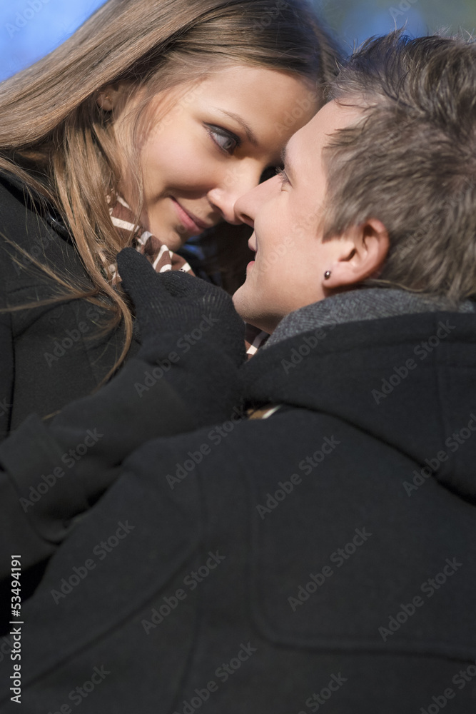 closeup portrait of young caucasian couple standing close to eac