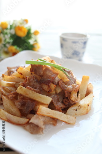 asian cuisine, potato and pork stir fried and tea