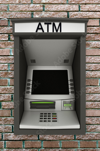 Automated teller machine on a brick wall