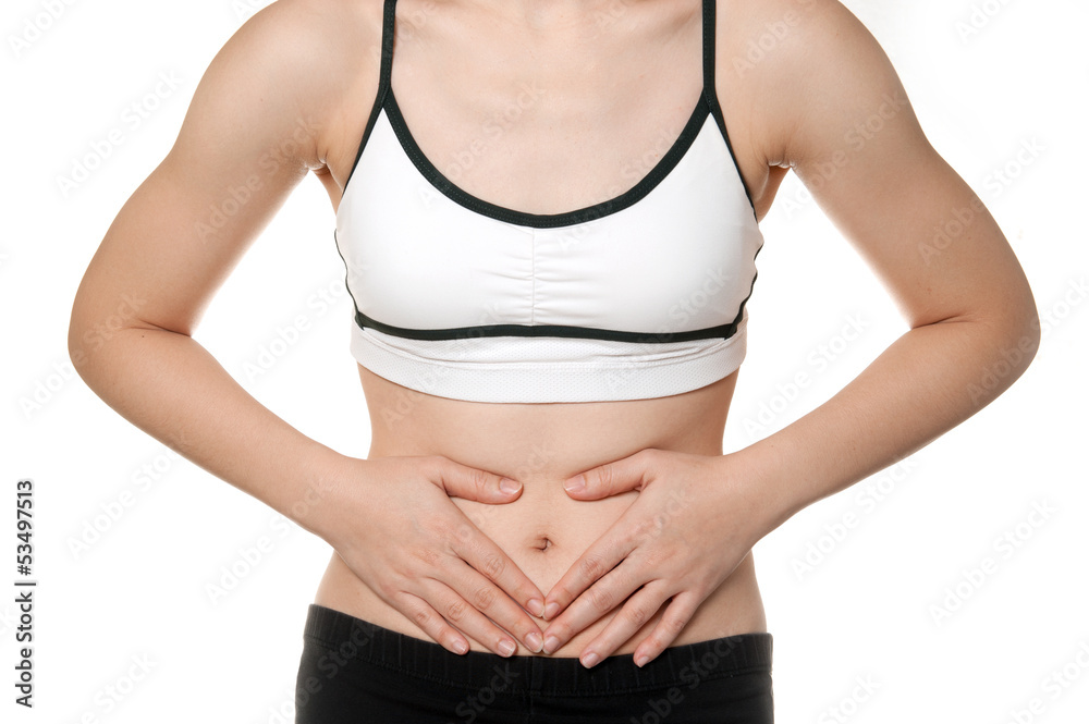© joesayhello - woman stomach ache in Sports wear isolated on white background