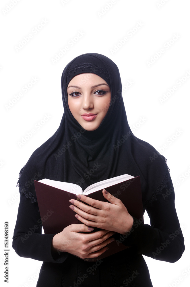 Young muslim woman with book on white Young muslim woman with book on white