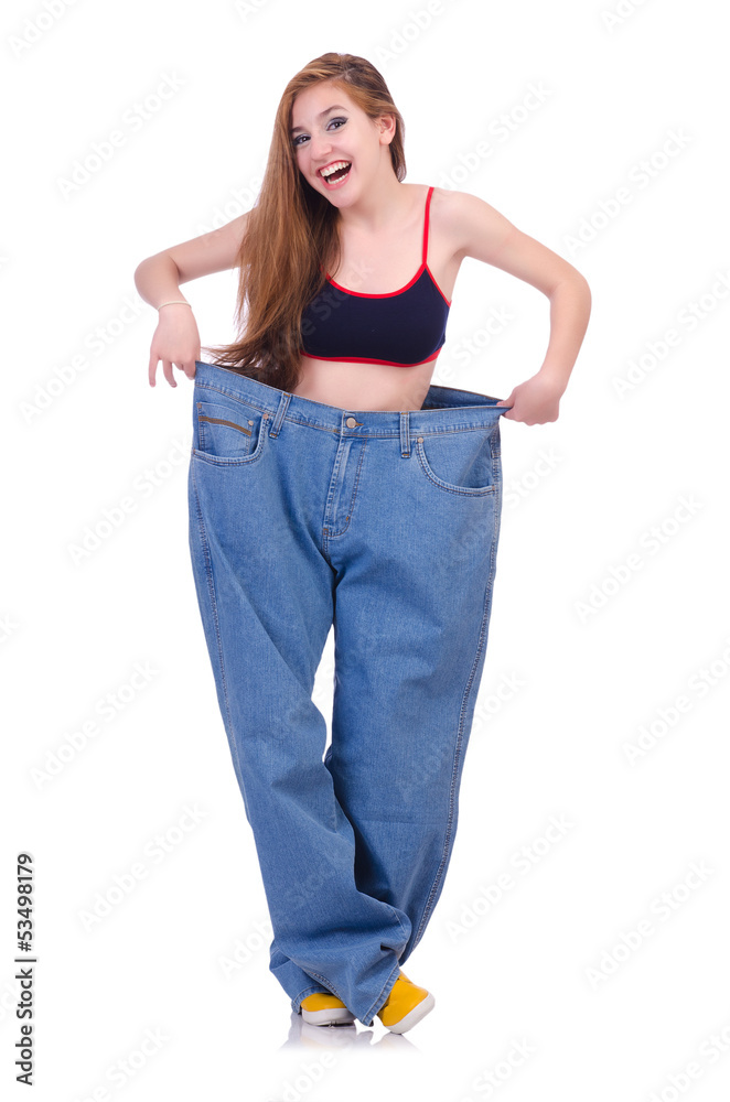 Woman in dieting concept with big jeans Woman in dieting concept with big jeans