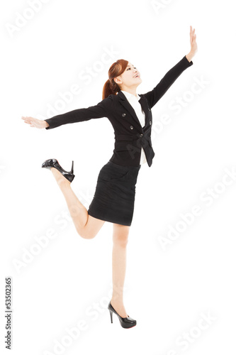 happy businesswoman jumping and try to reach something