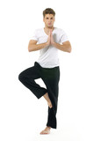 An attractive athletic man doing a yoga pose
