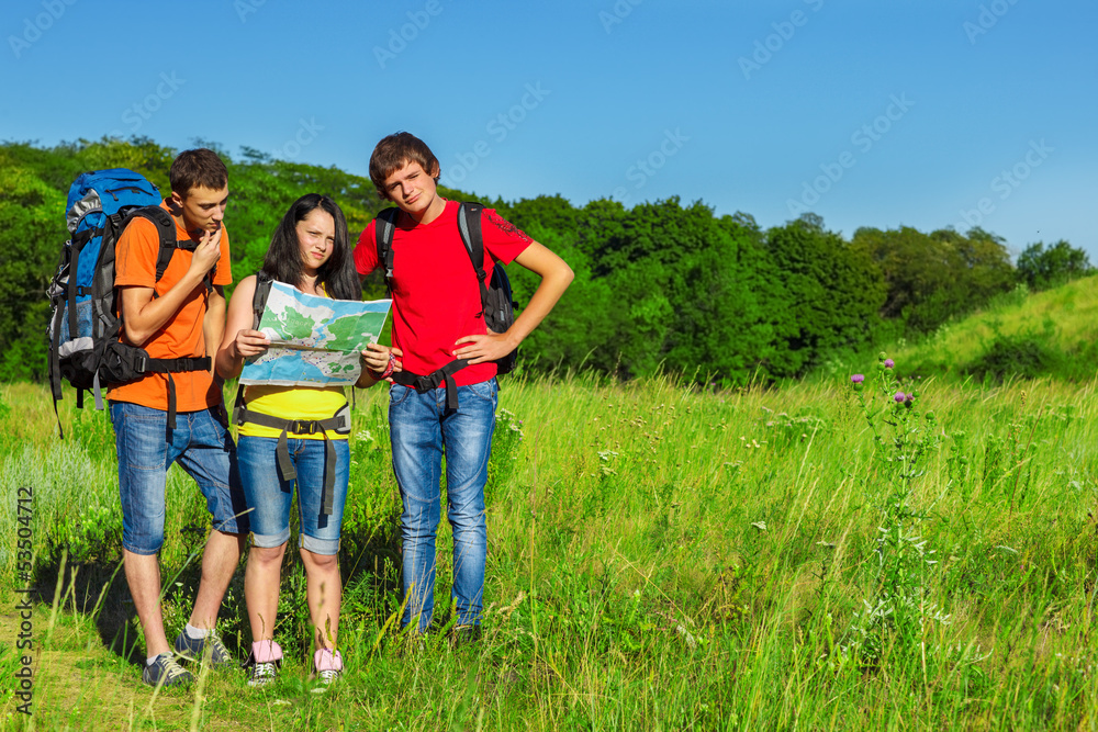 Teenage friends backpacking